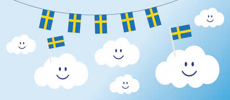 Glad moln och svenska flaggor
